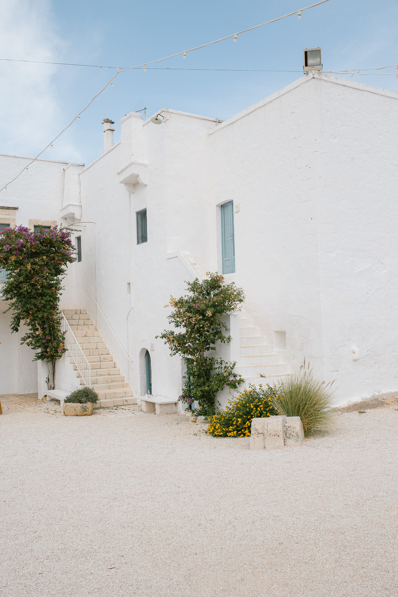 Whitewashed facade of Masseria Mozzone in Puglia