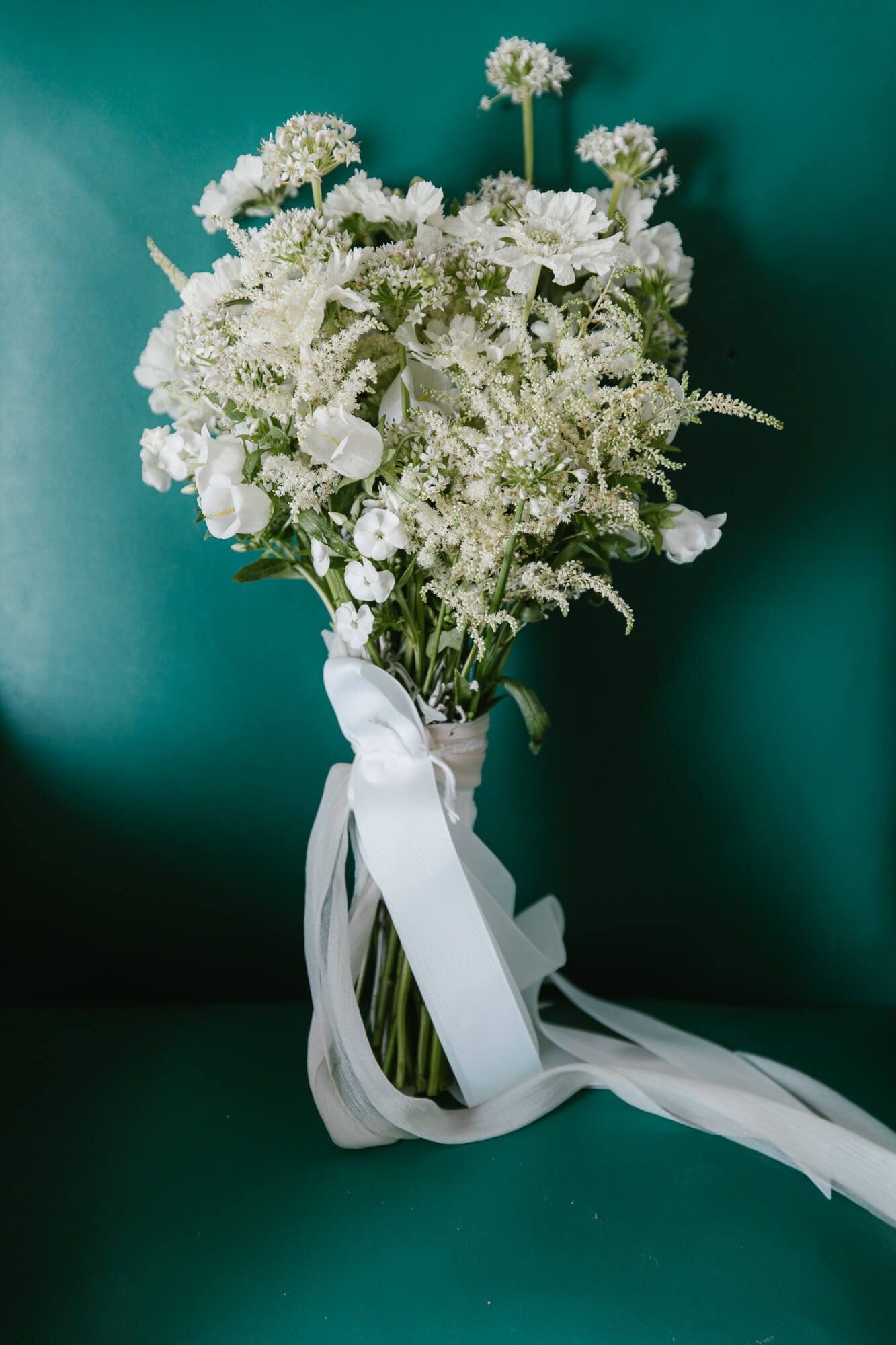 White wildflower bridal bouquet with silk ribbons
