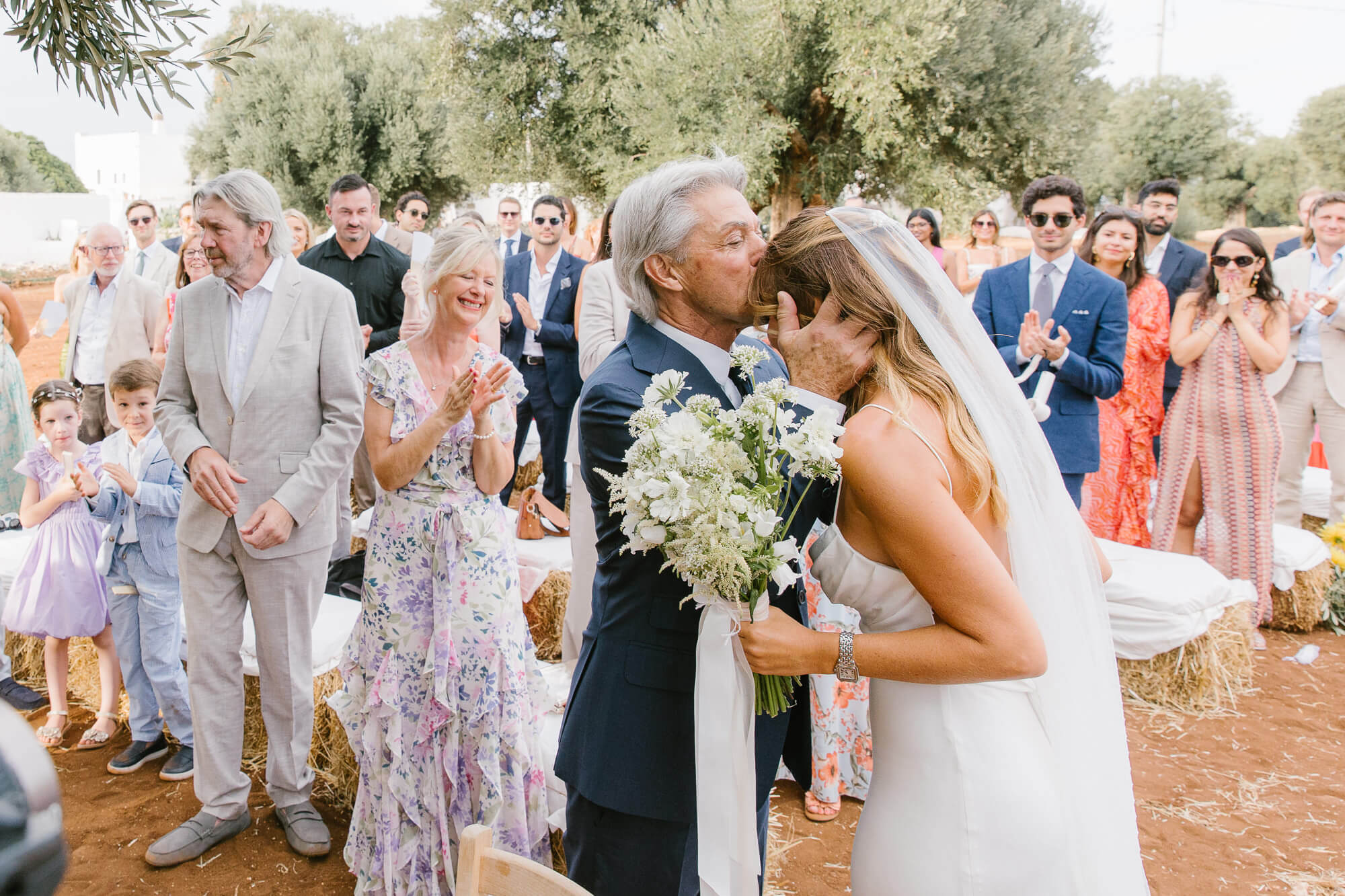 Father giving the bride away in the olive grove