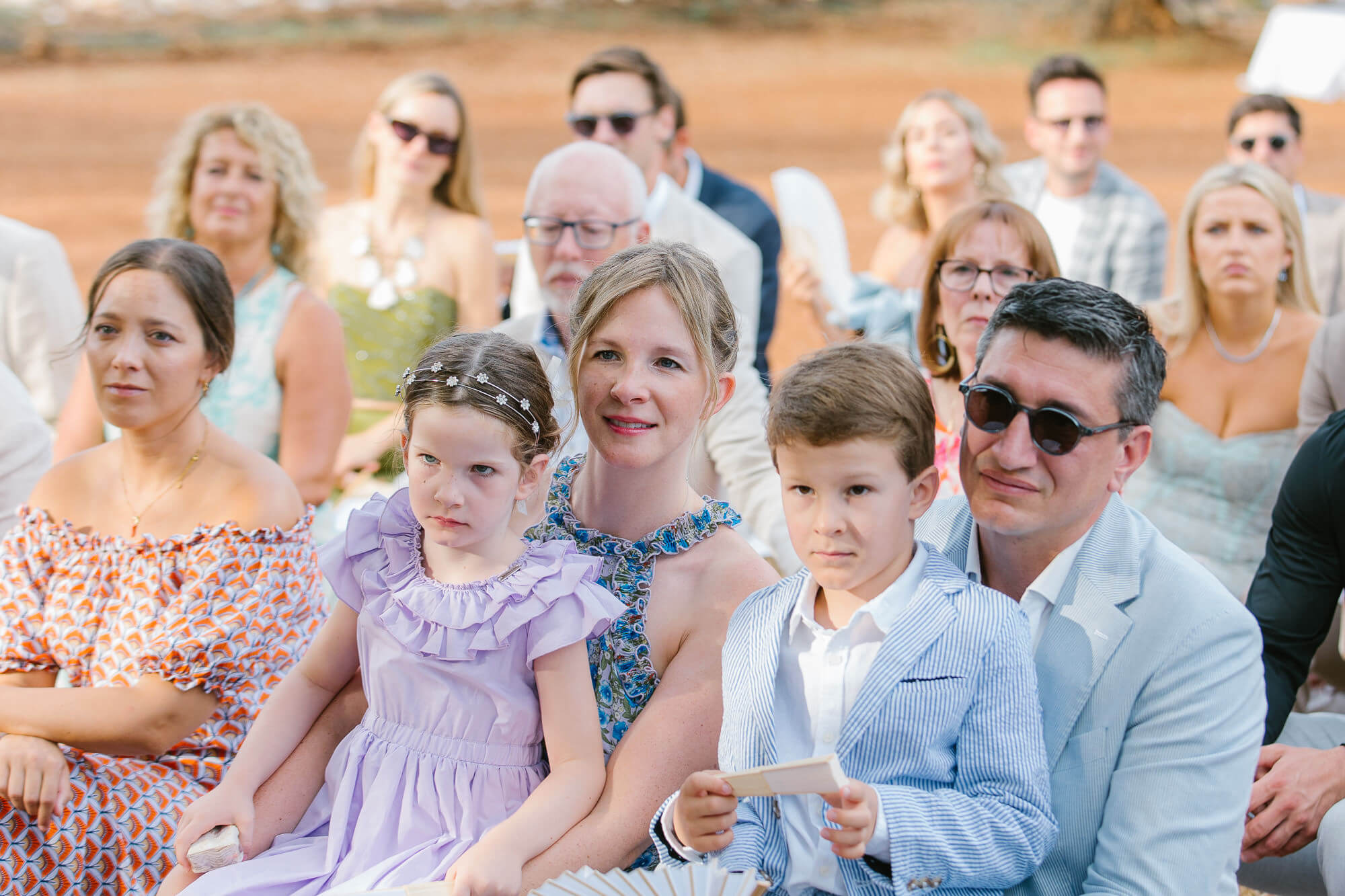 Children and guests watching the wedding ceremony
