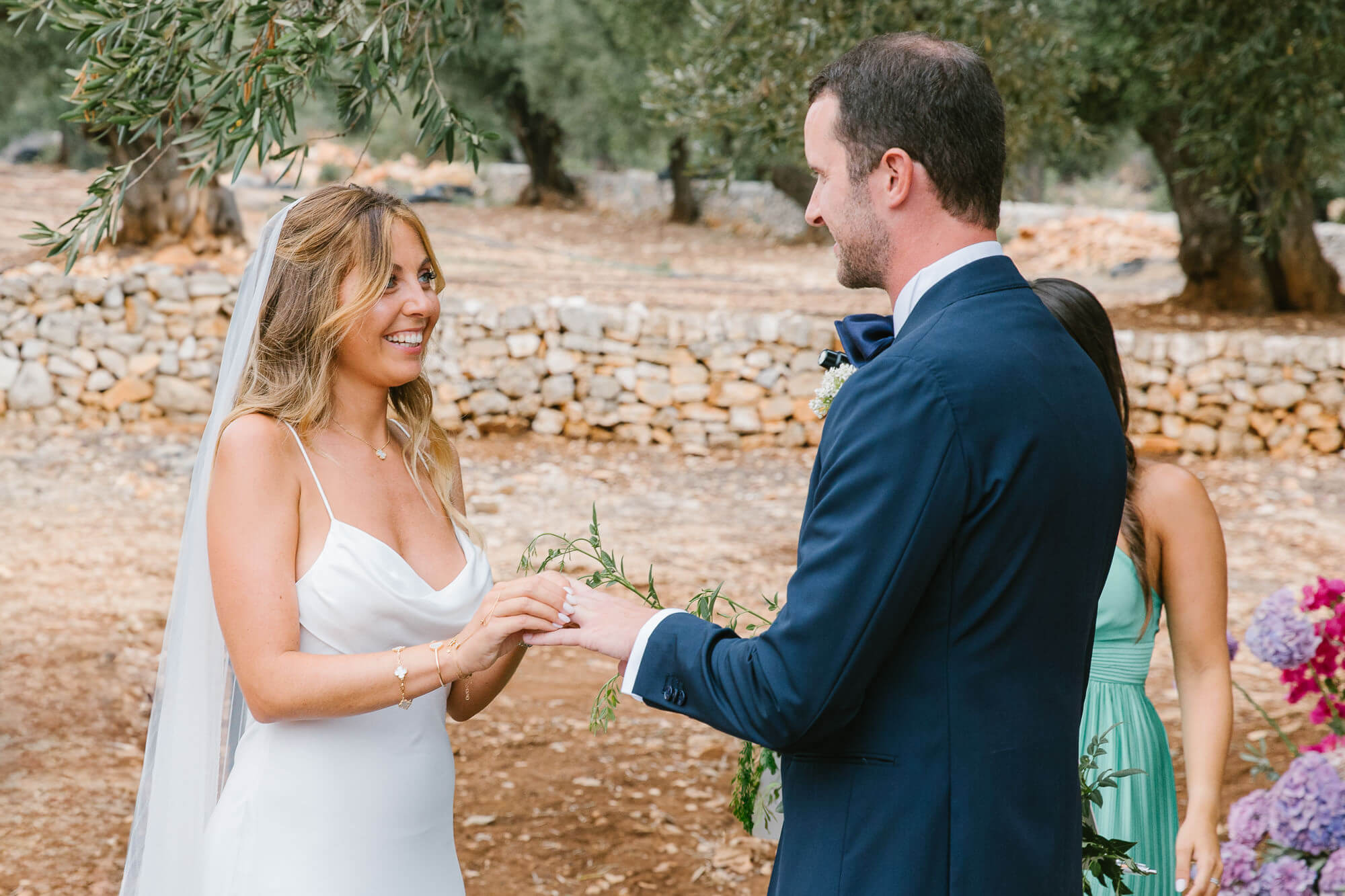 Ring exchange at an olive grove wedding
