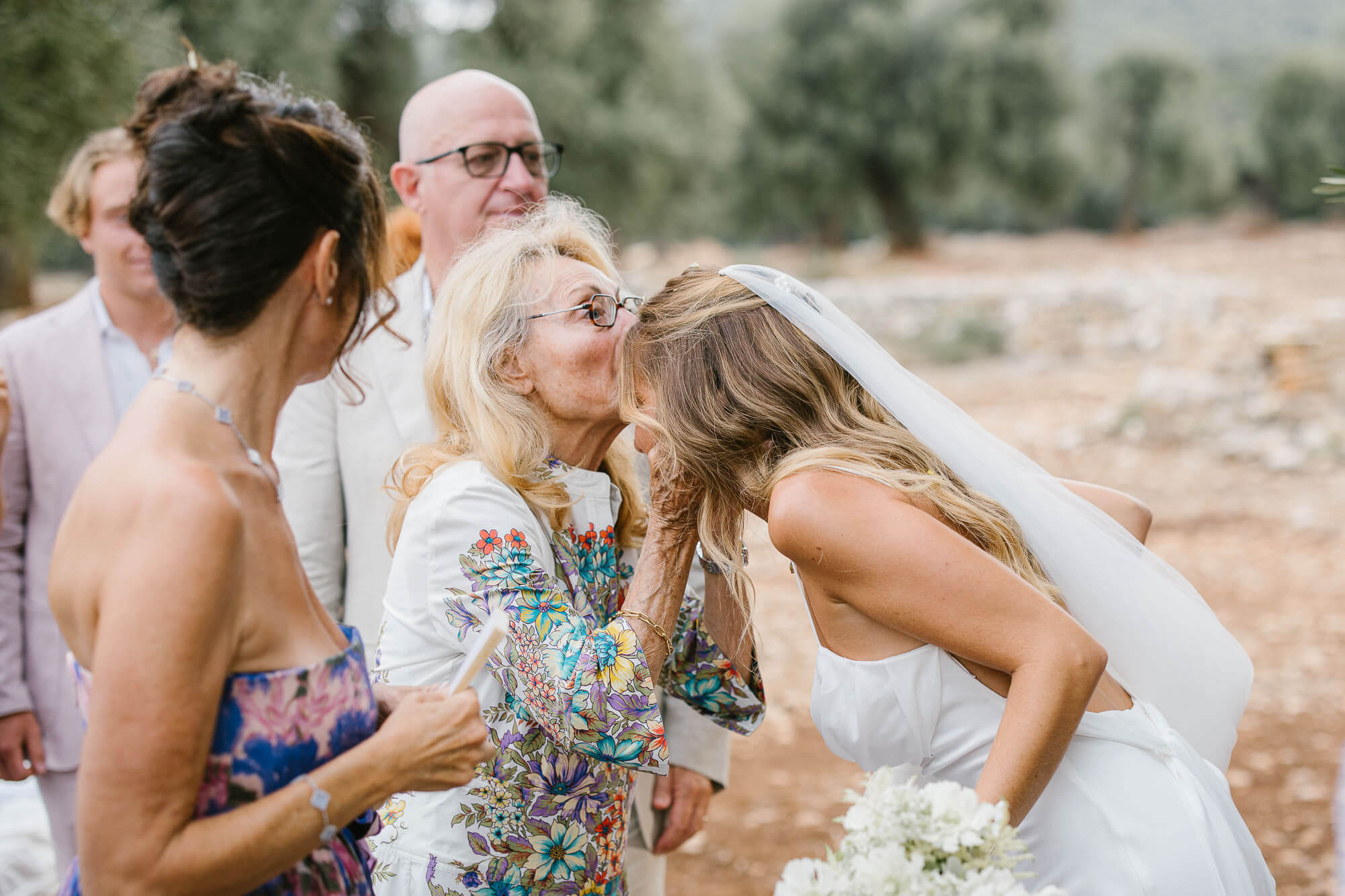 Bride hugging guests after the ceremony