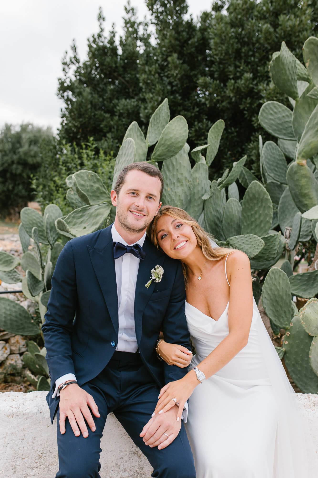 Couple portrait among prickly pears in Puglia