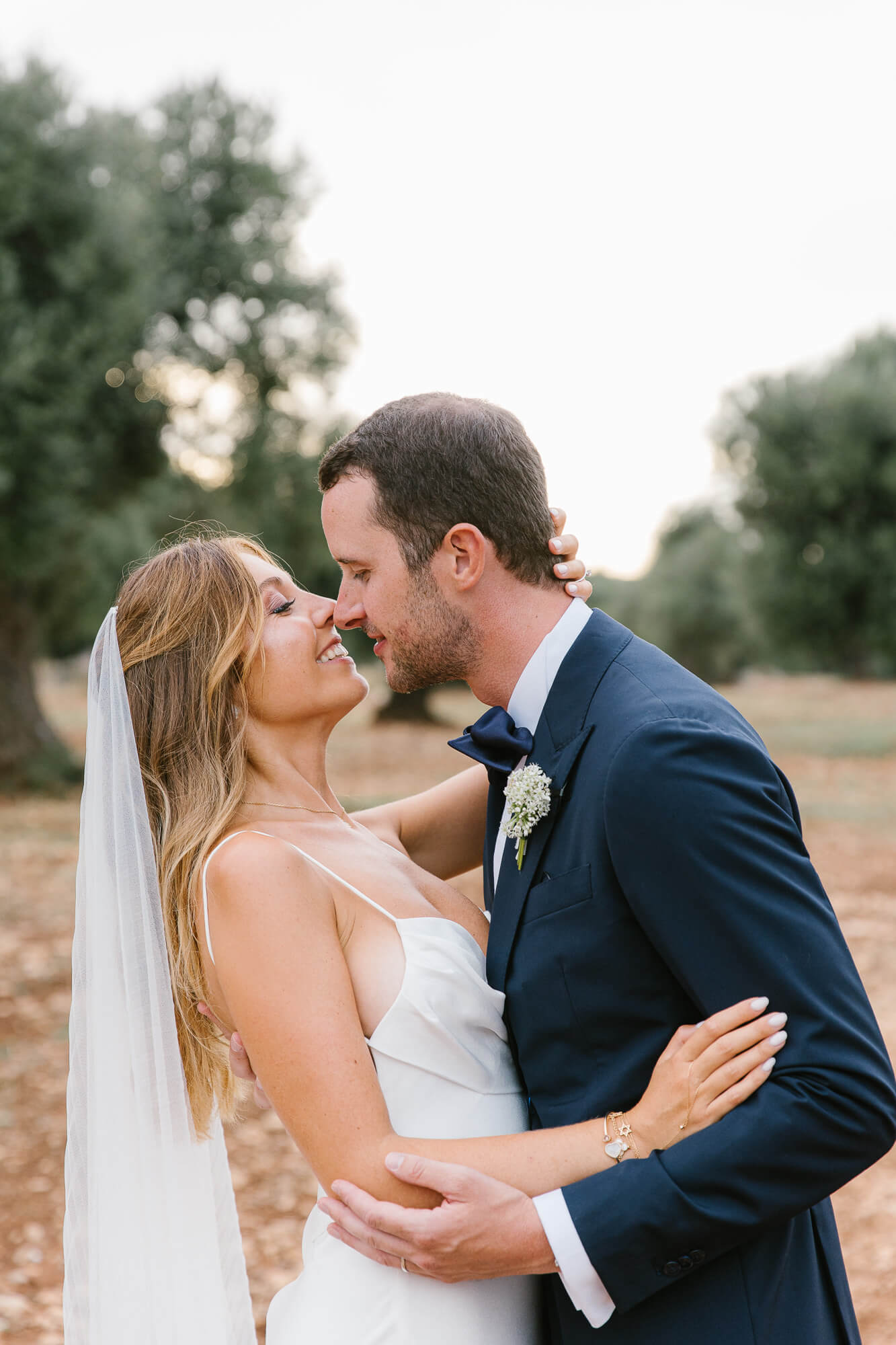 Couple embracing in the olive grove