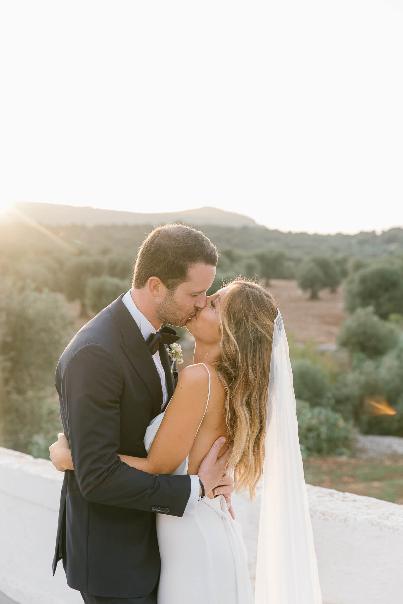 Golden hour kiss on the terrace at Masseria Mozzone