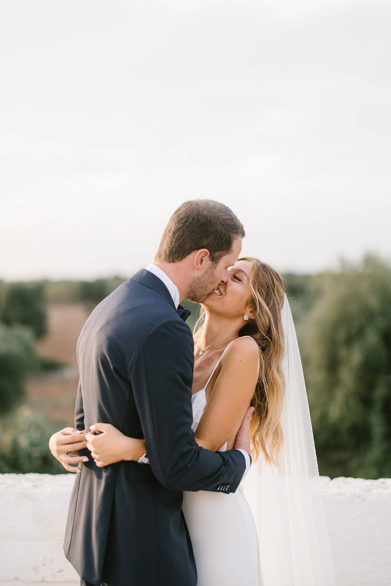 Couple embracing at golden hour on the terrace