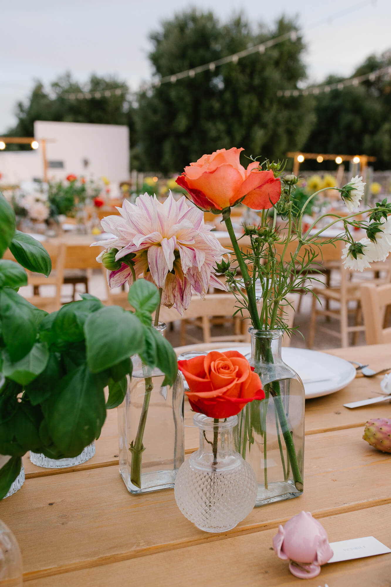 Table flowers and tomatoes at a Puglia wedding