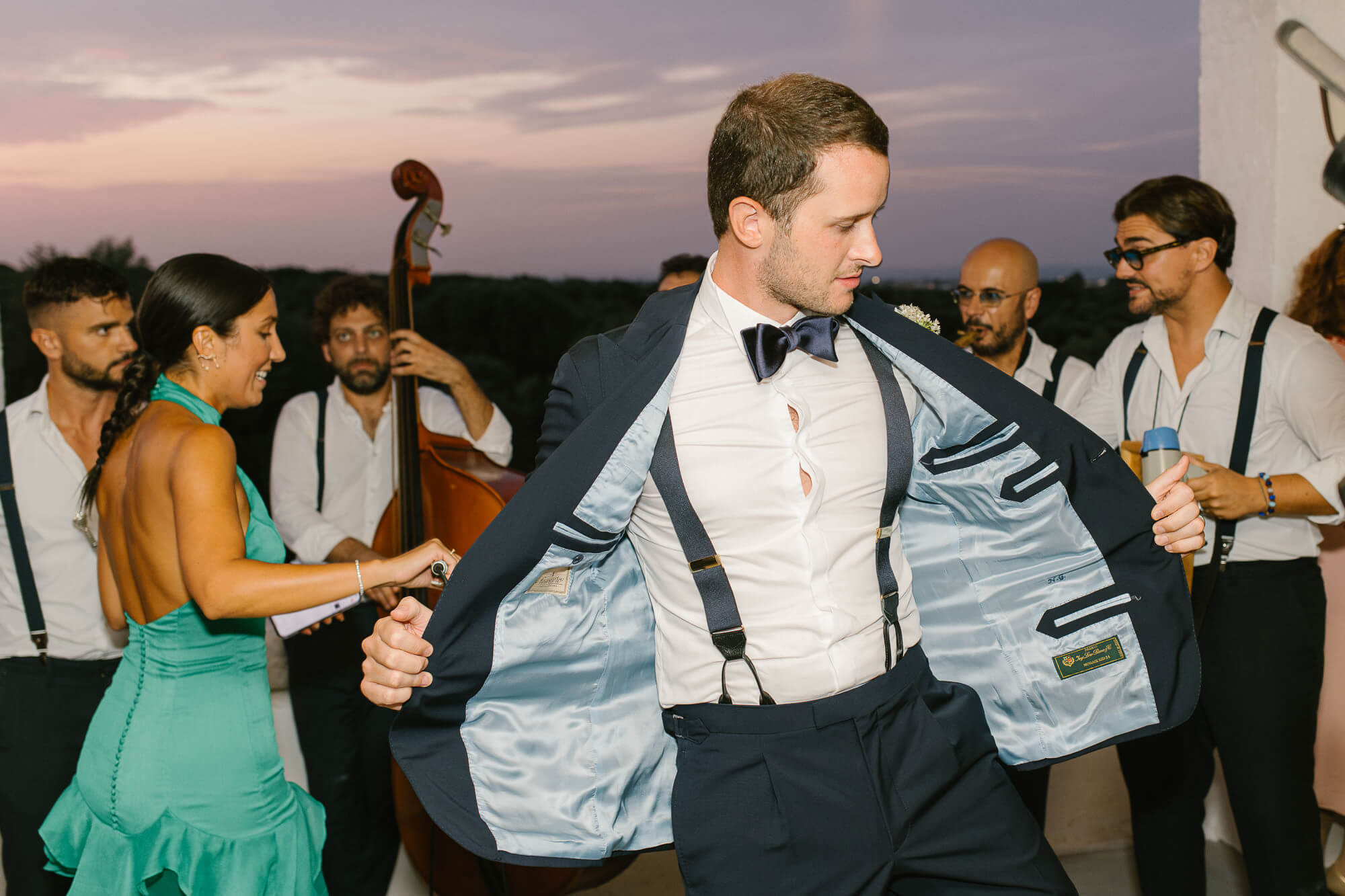 Groom dancing with the band