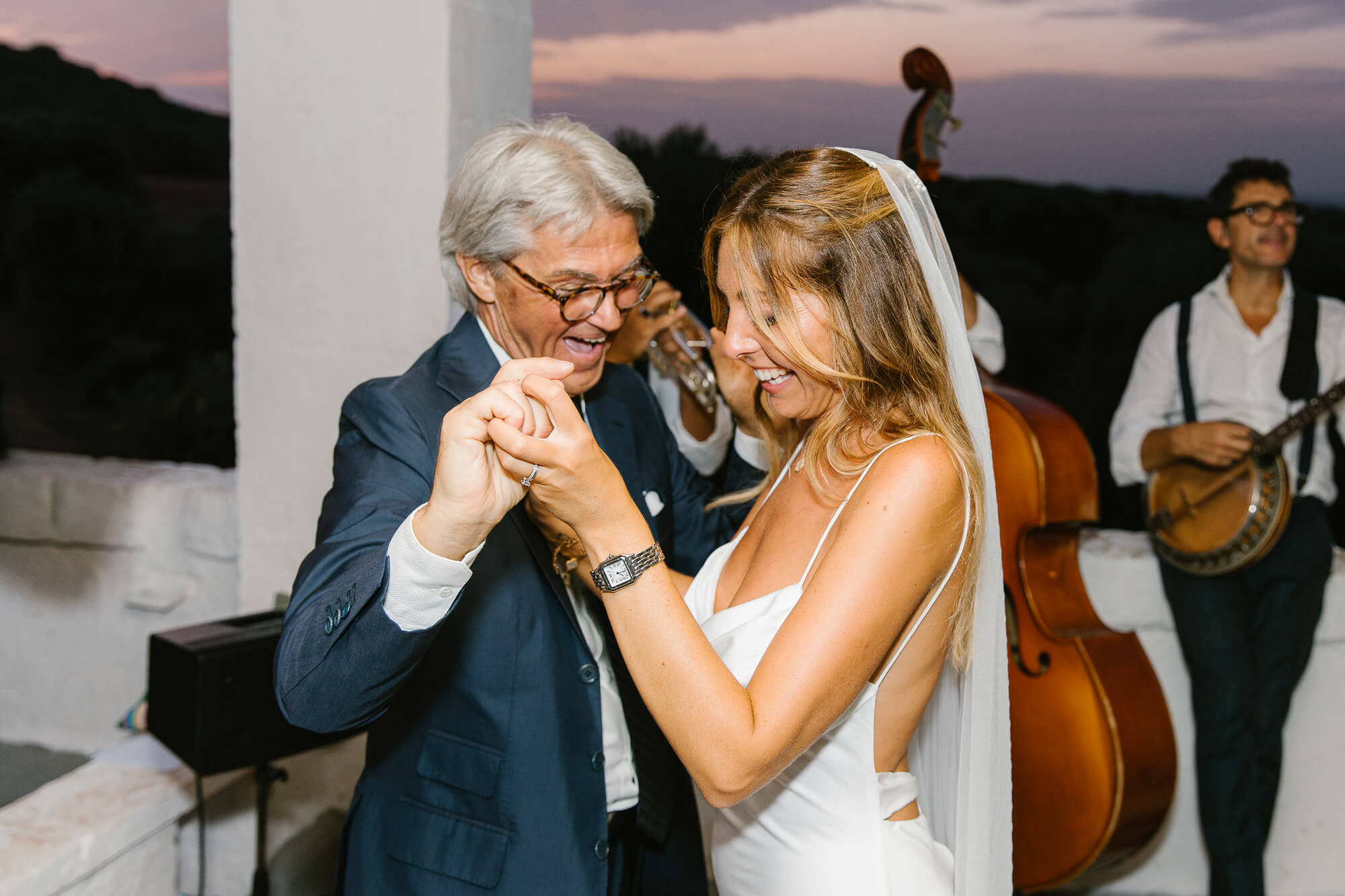Father and bride dancing with a live band