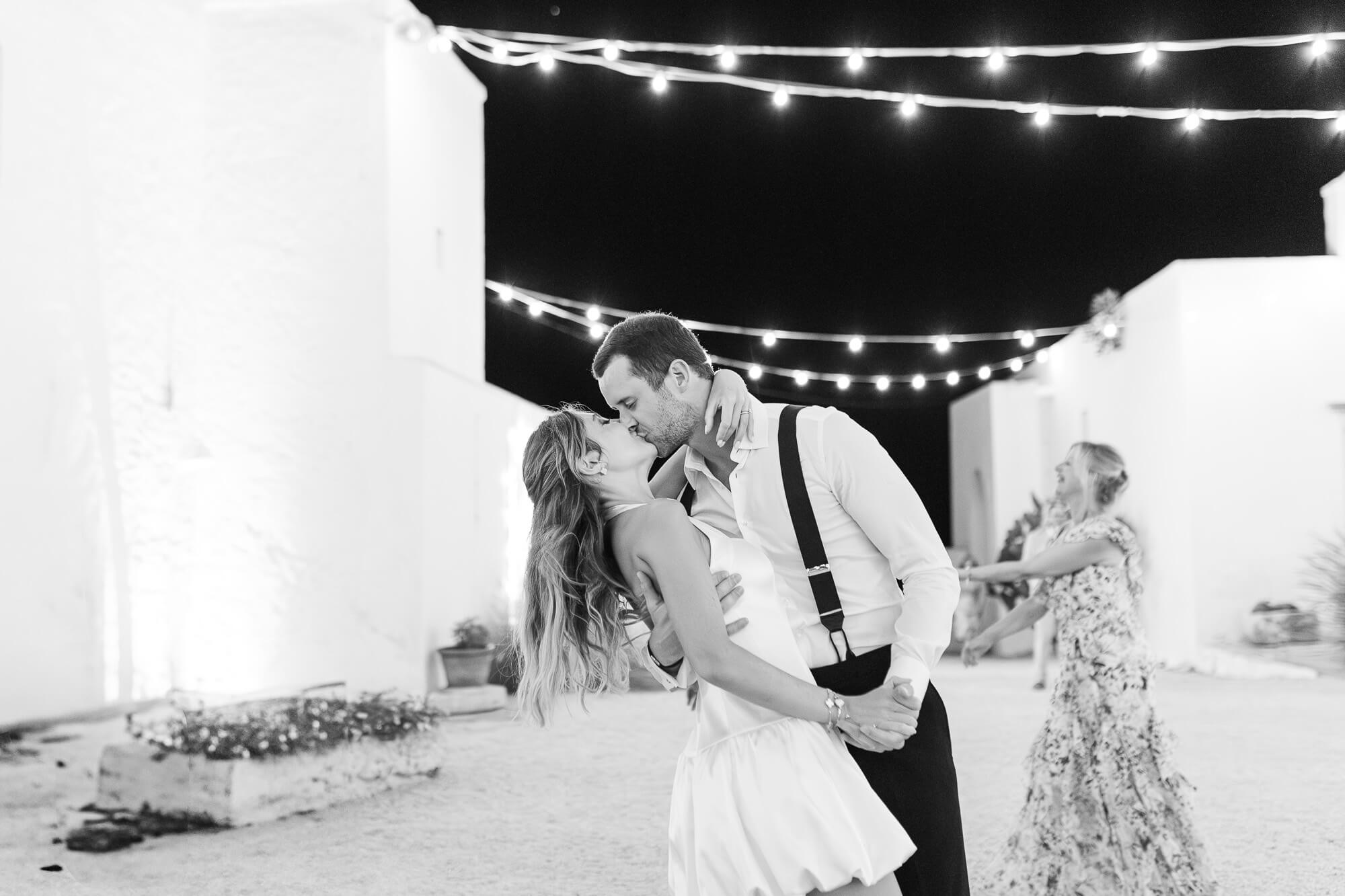First dance under the string lights at Masseria Mozzone