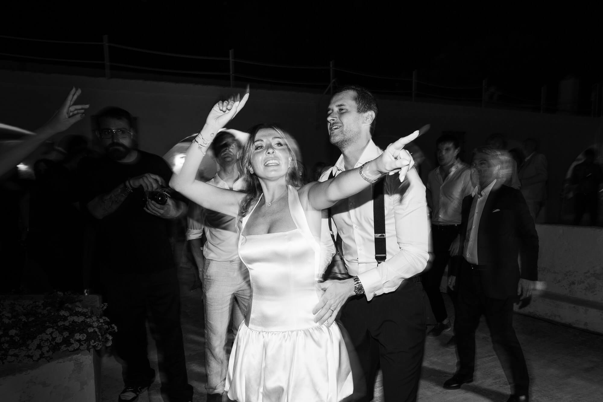 Bride and groom dancing, black and white