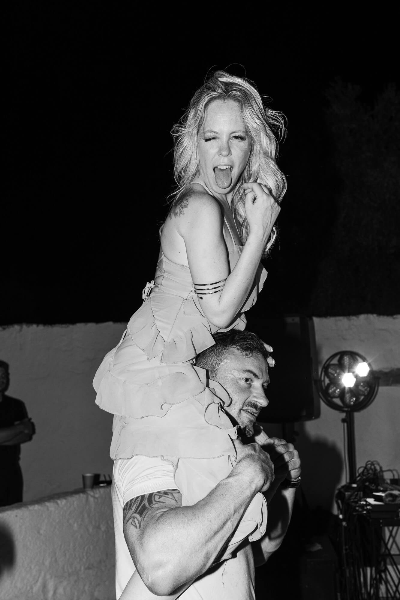 Bride on a friend's shoulders at the wedding party