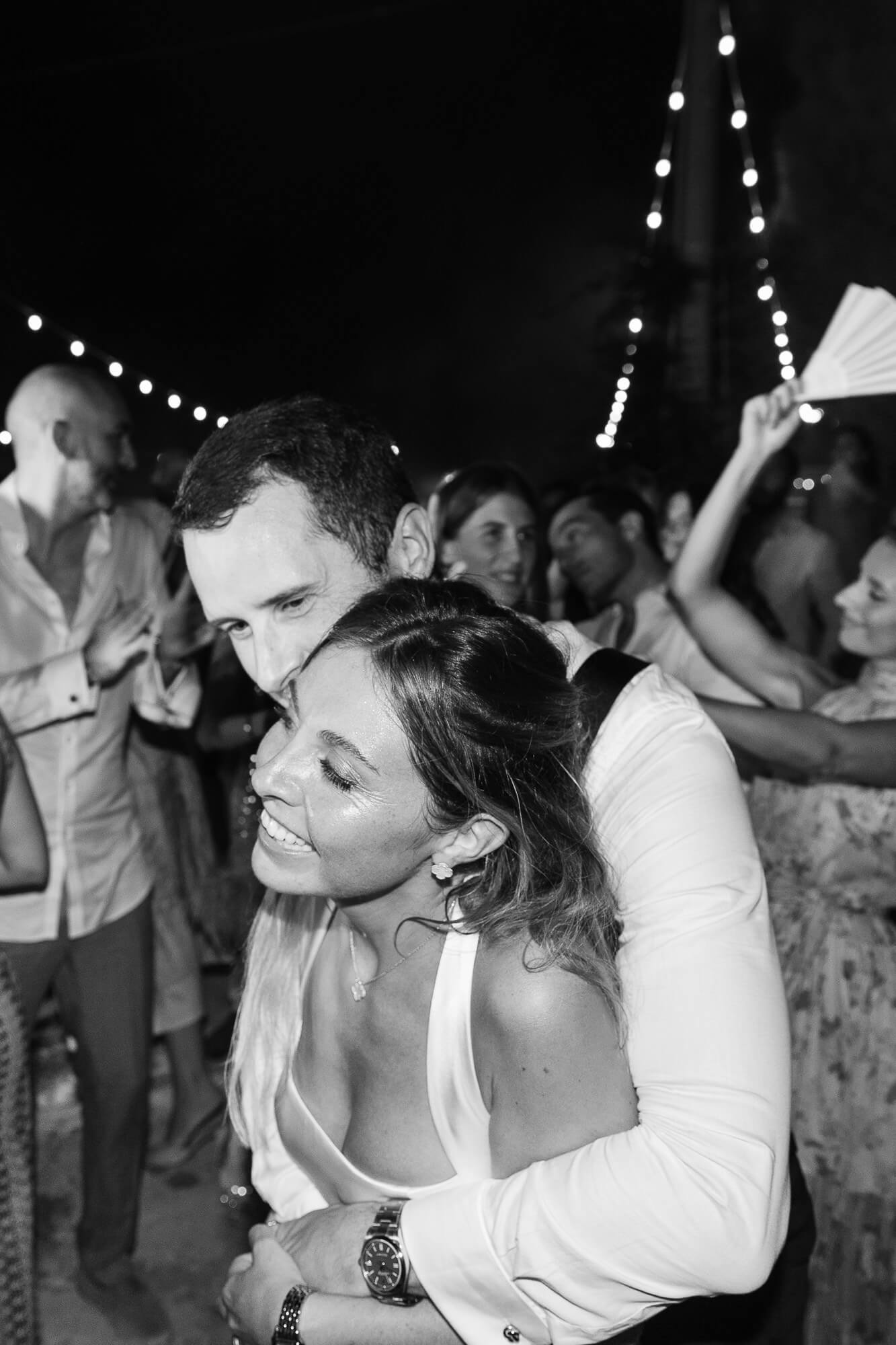 Couple dancing close at the end of the night